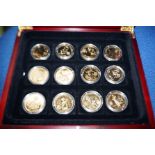 Collection of 12 gold plated coins in presentation