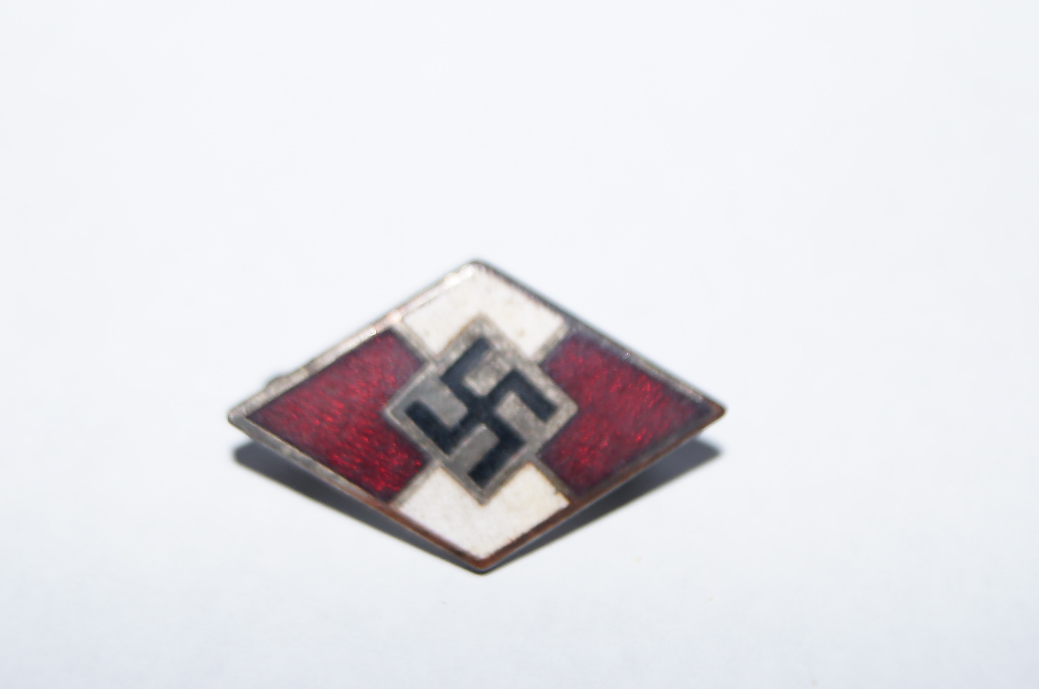 Enamelled swastika badge