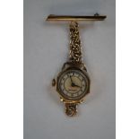 Ladies yellow metal fob watch by Medana Possibly g