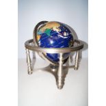 Gimbal revolving globe in set with various hard st