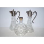 2 Pewter mounted claret jugs together with a cogna