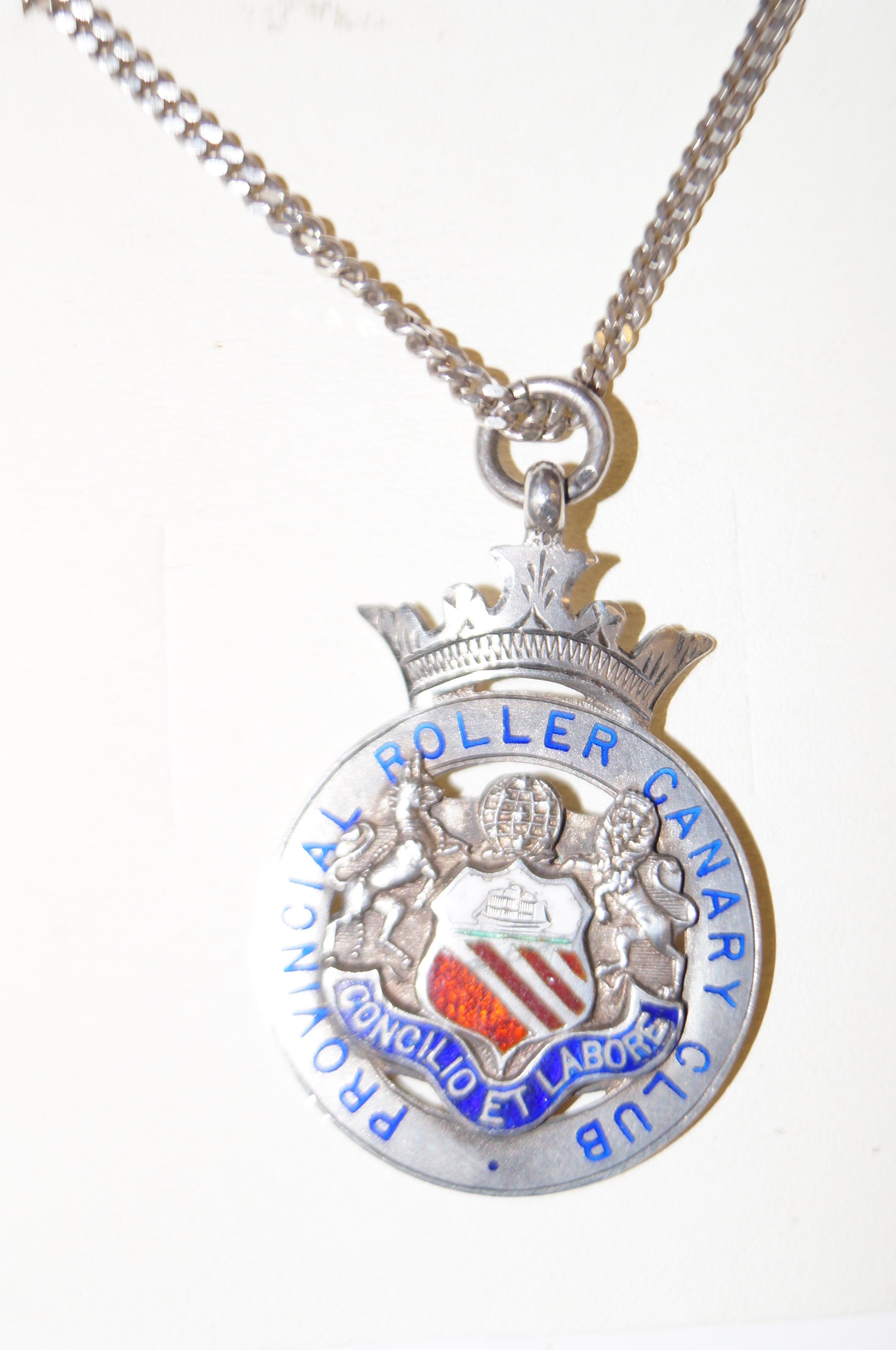 Silver Canary medal & chain