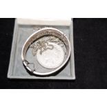 Silver Bangle together with a Limited 1928 Dollar