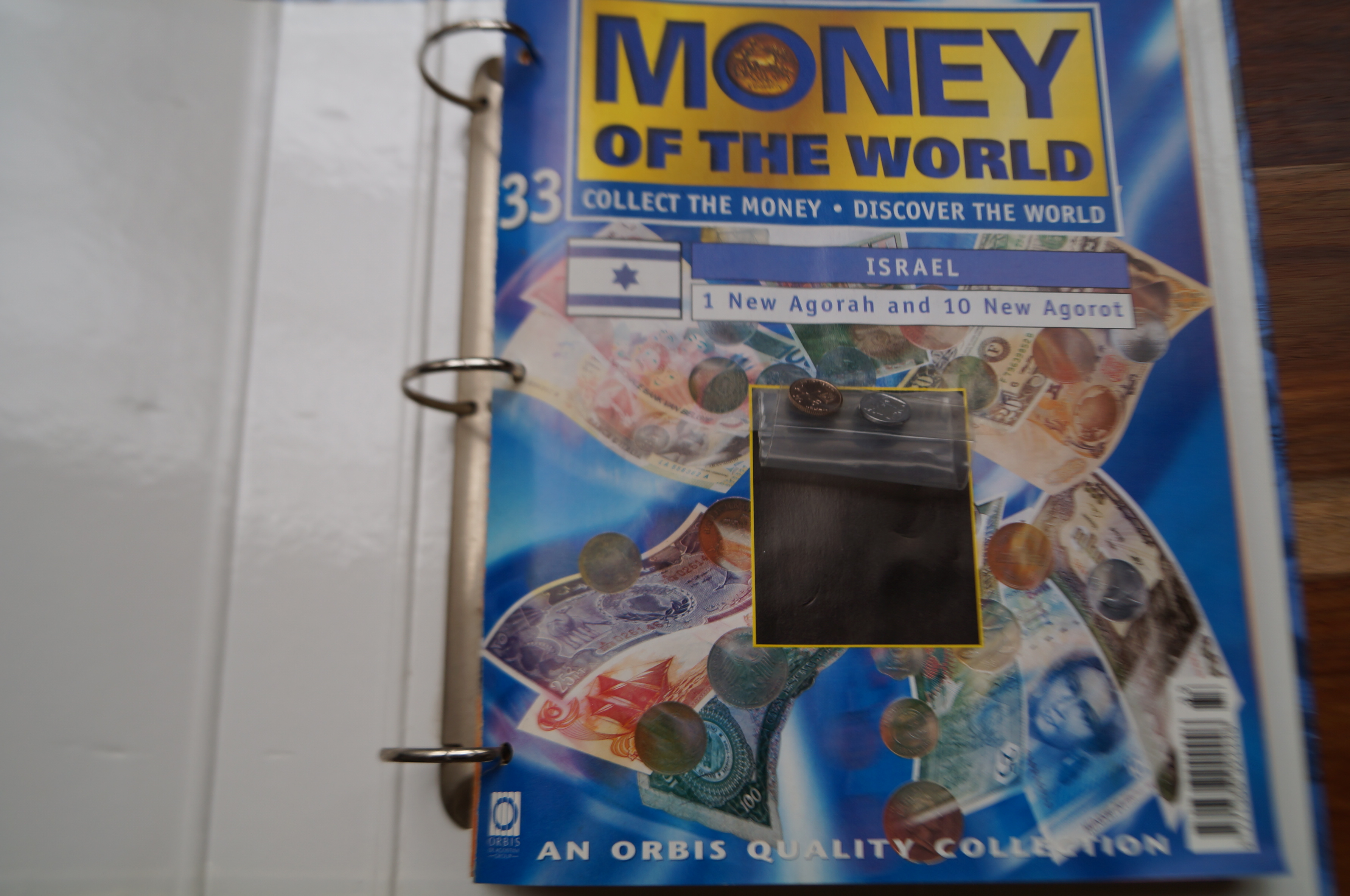 Money of the world collectors folder with coins &