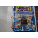 Money of the world collectors folder with coins &