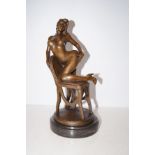 Bronze figure of a nude lady on a chair signed