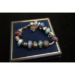 Chamila silver charm bracelet with 17 charms