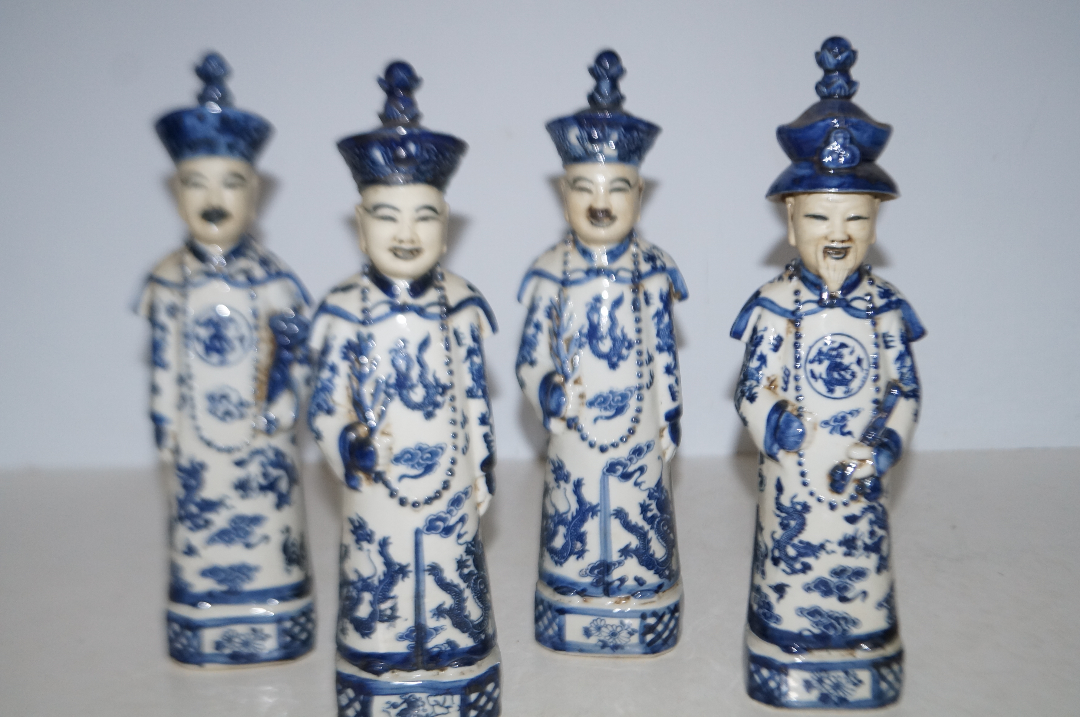 4 ceramic blue & white oriental figures Height 30