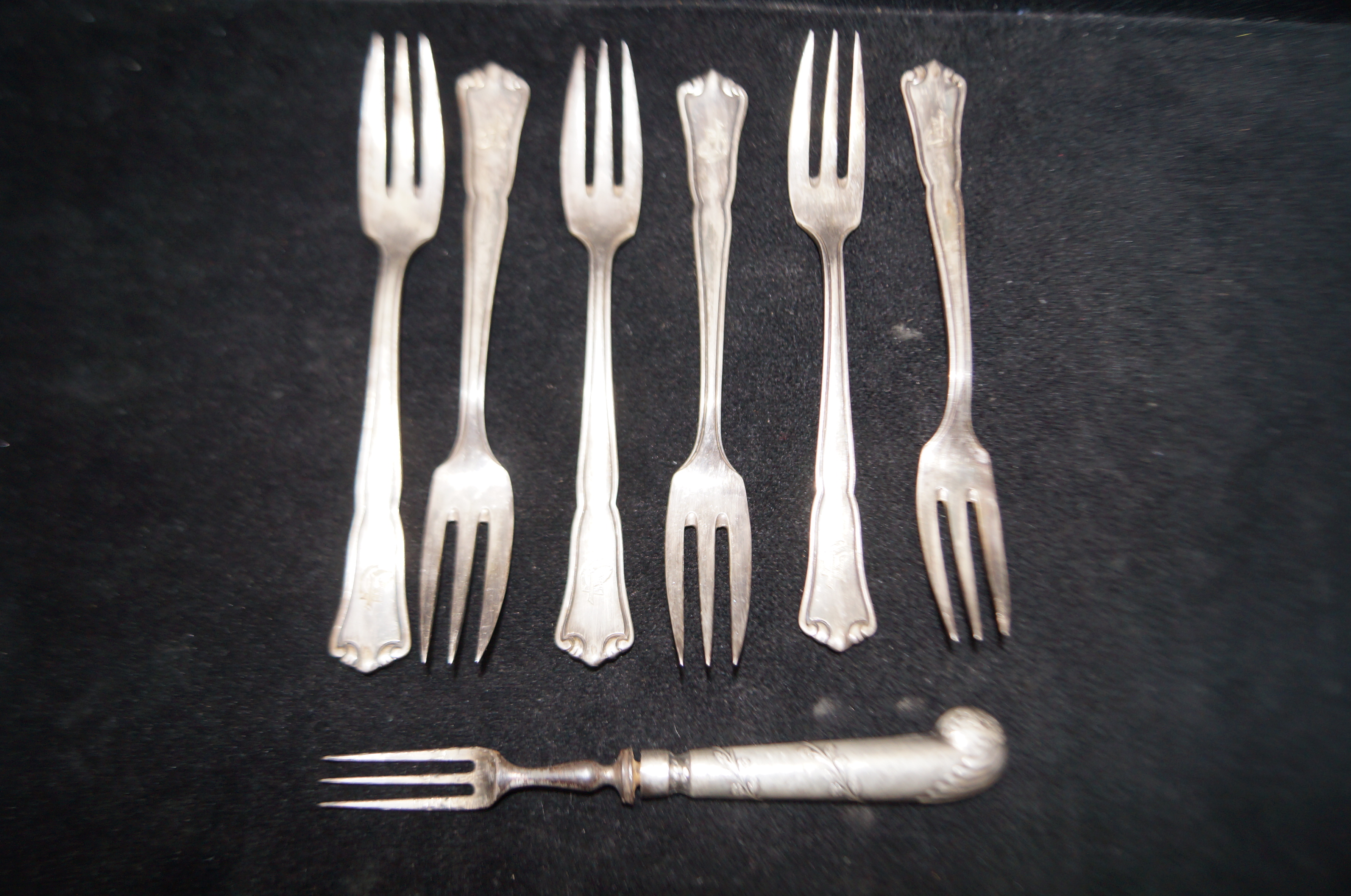 Set of 6 800 grade silver forks together with silv