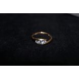 9ct Gold dress ring set with 3 white gem stones Si