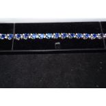 Silver bracelet with blue gem stones