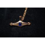 Victorian 9ct gold pin brooch with central blue ge