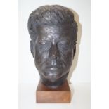 Bronze effect bust in the form of J.F.K on wooden