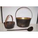 Large brass jam pan together with a smaller exampl