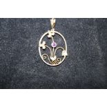 9ct Gold art nouveau pendant set with central amet