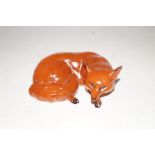 Beswick fox curled up lying down