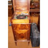 Cased gramophone with many records