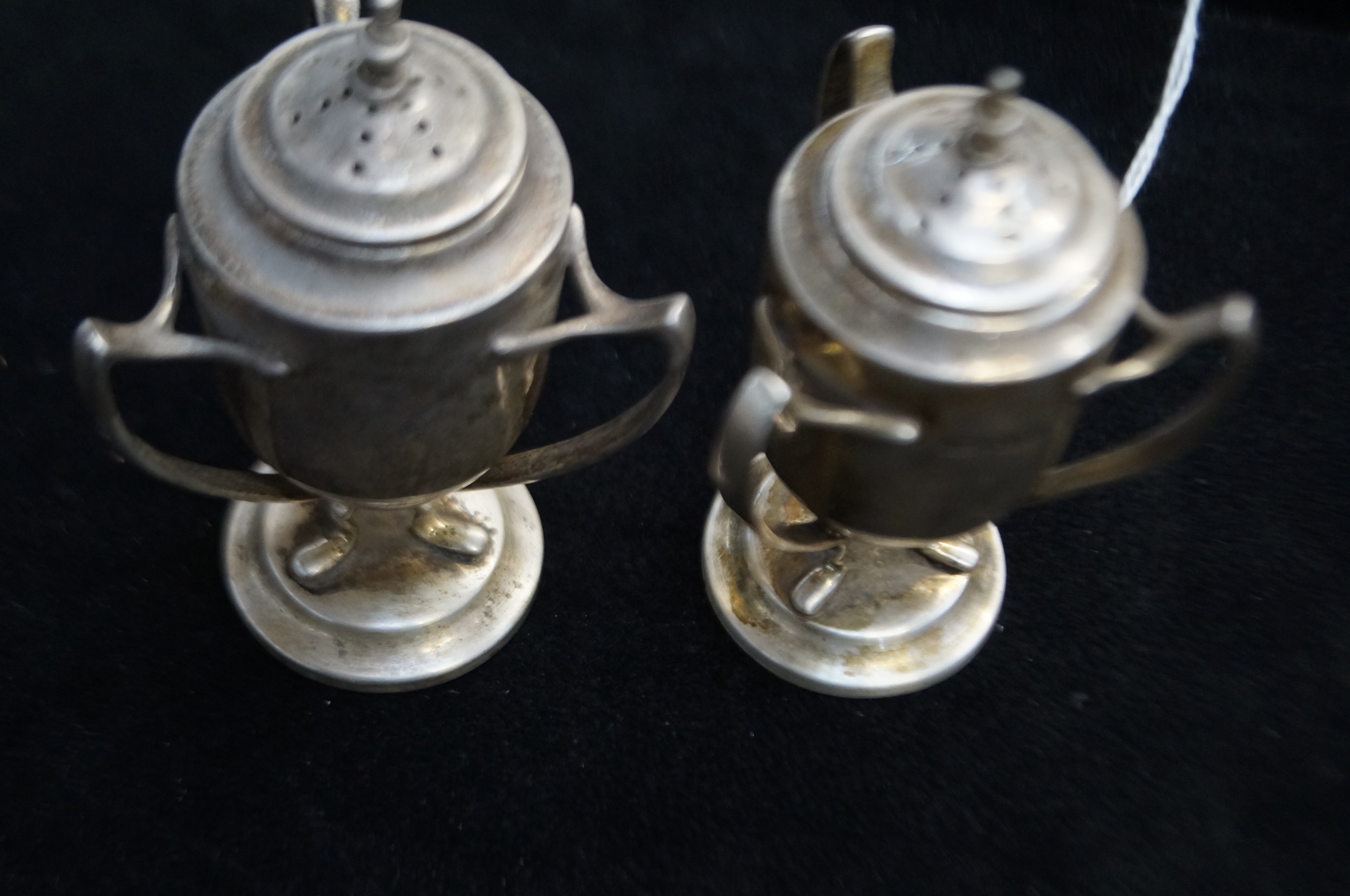 Pair of hallmarked silver pepper pots with Sheffie