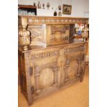 Jacobean revival solid oak court cupboard, upper section with blind covered, cup & cover supports,