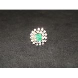 18 carat white gold emerald and diamond cluster ri