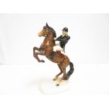 Beswick huntsman on a jumping horse (Black coat). Restoration to figure