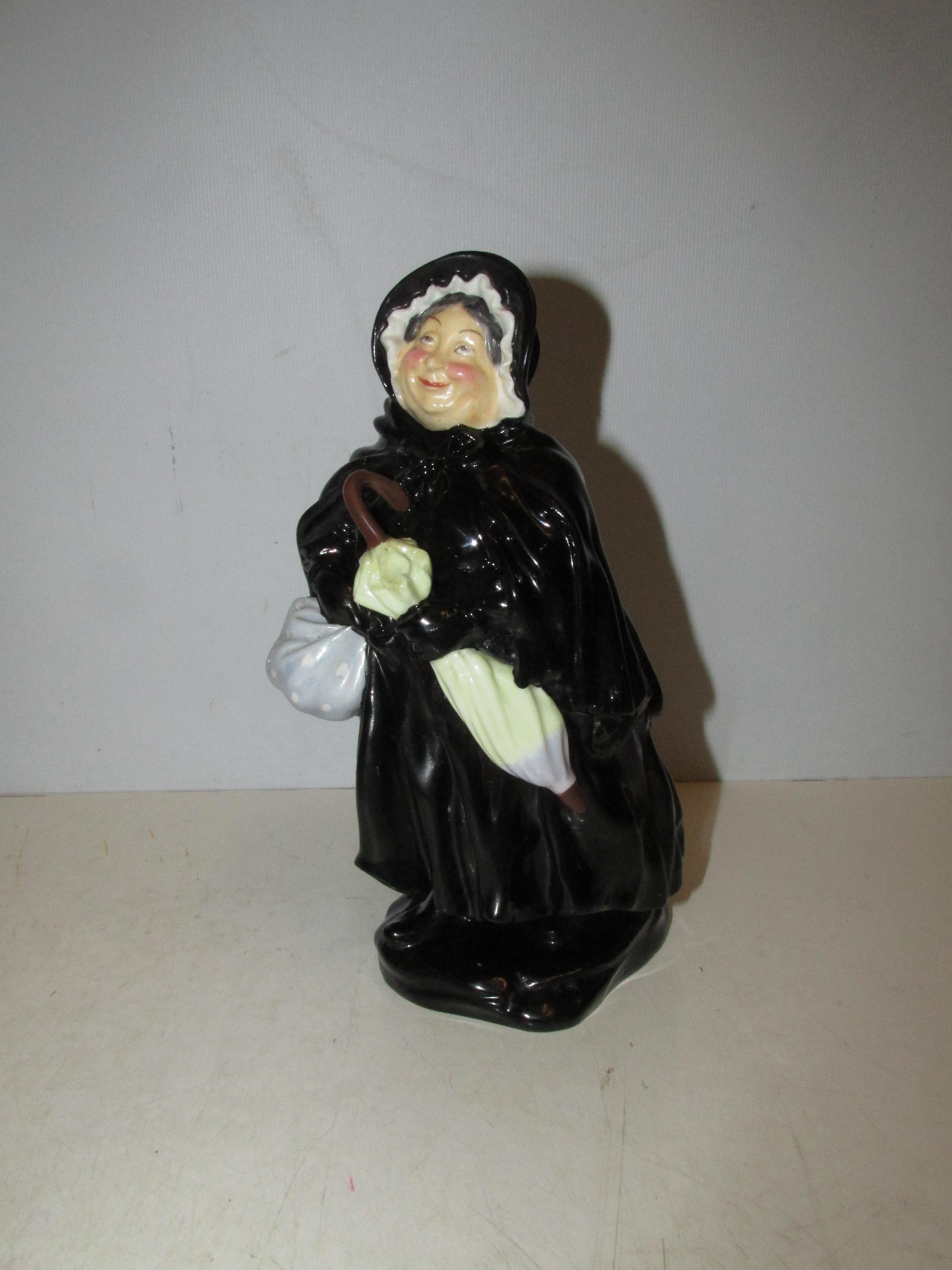 Royal Doulton HN 558 'Sairey Gamp' Figurine. Height 18cm. Restoration to figure