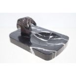 Art deco marble ashtray with bulldog finials