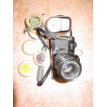 Vintage canon camera with various lenses & exposur