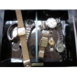 Glazed & mirrored case containing assorted wristwa