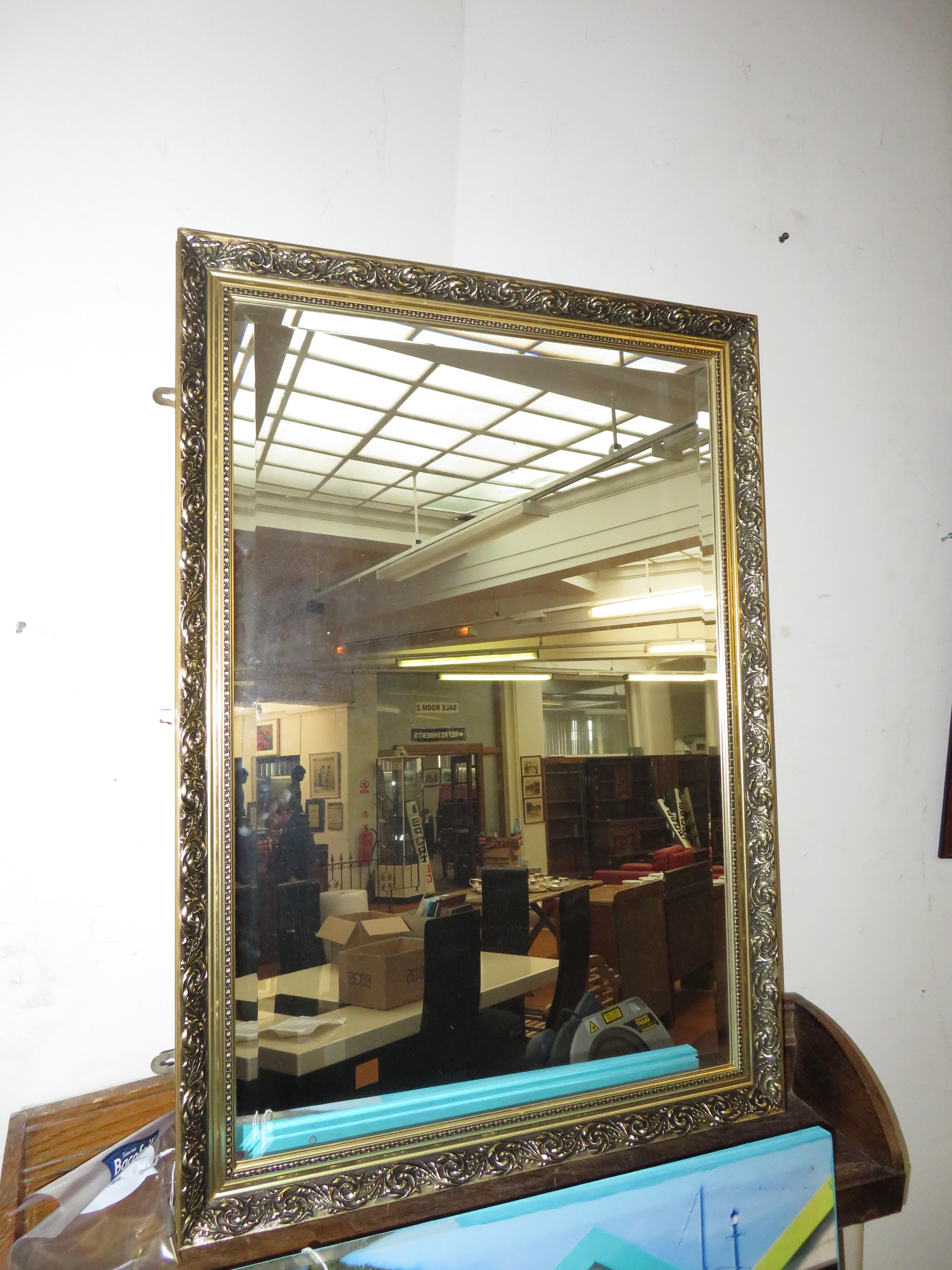 Large gilt framed bevelled mirror
