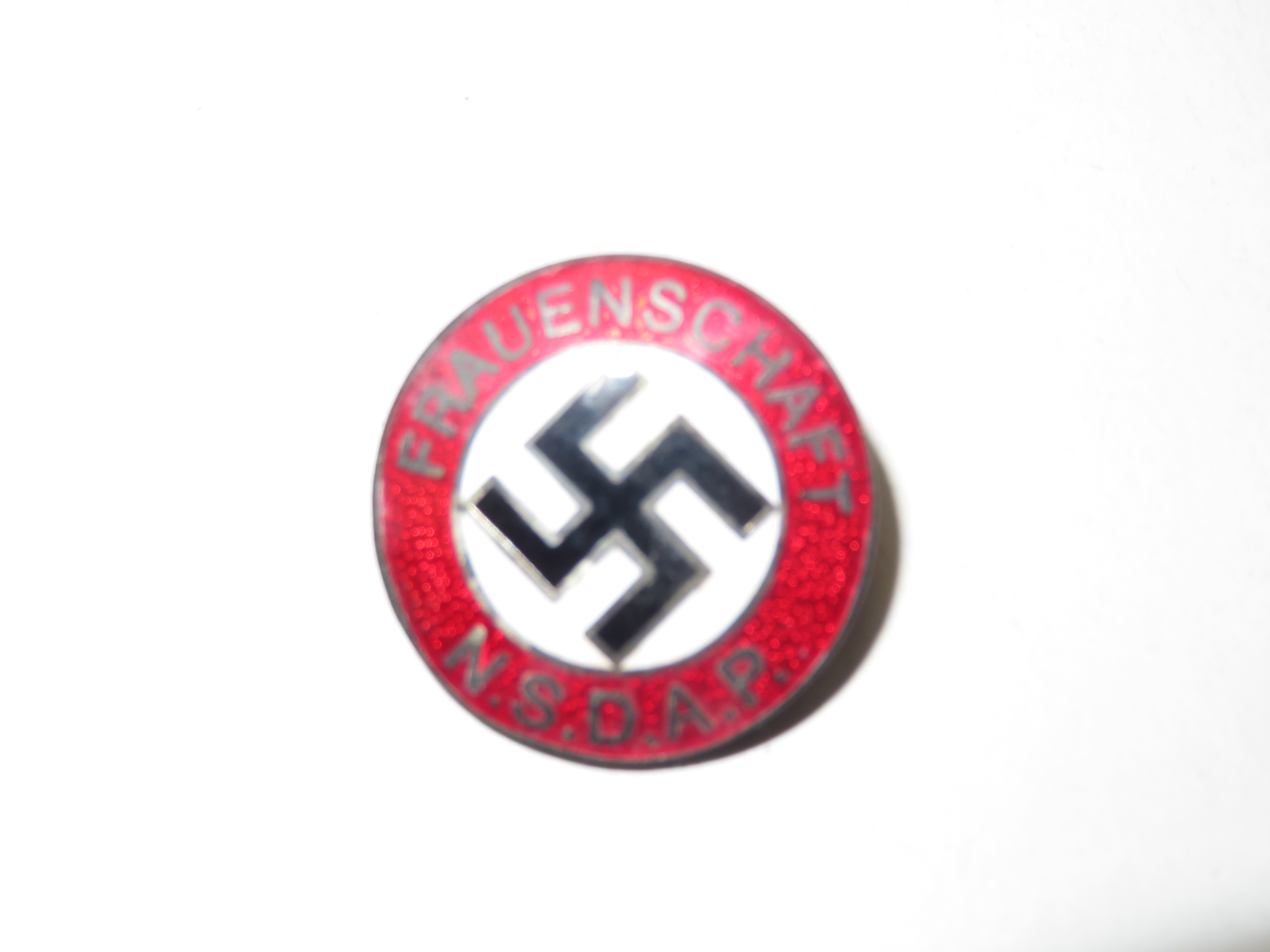 Enamel swastika badge