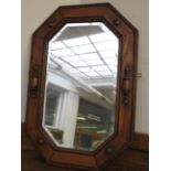 Bevelled edged wall mirror in oak frame