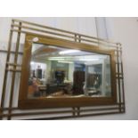 Contemporary large brass mirror