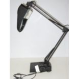 Angle poise magnifying lamp