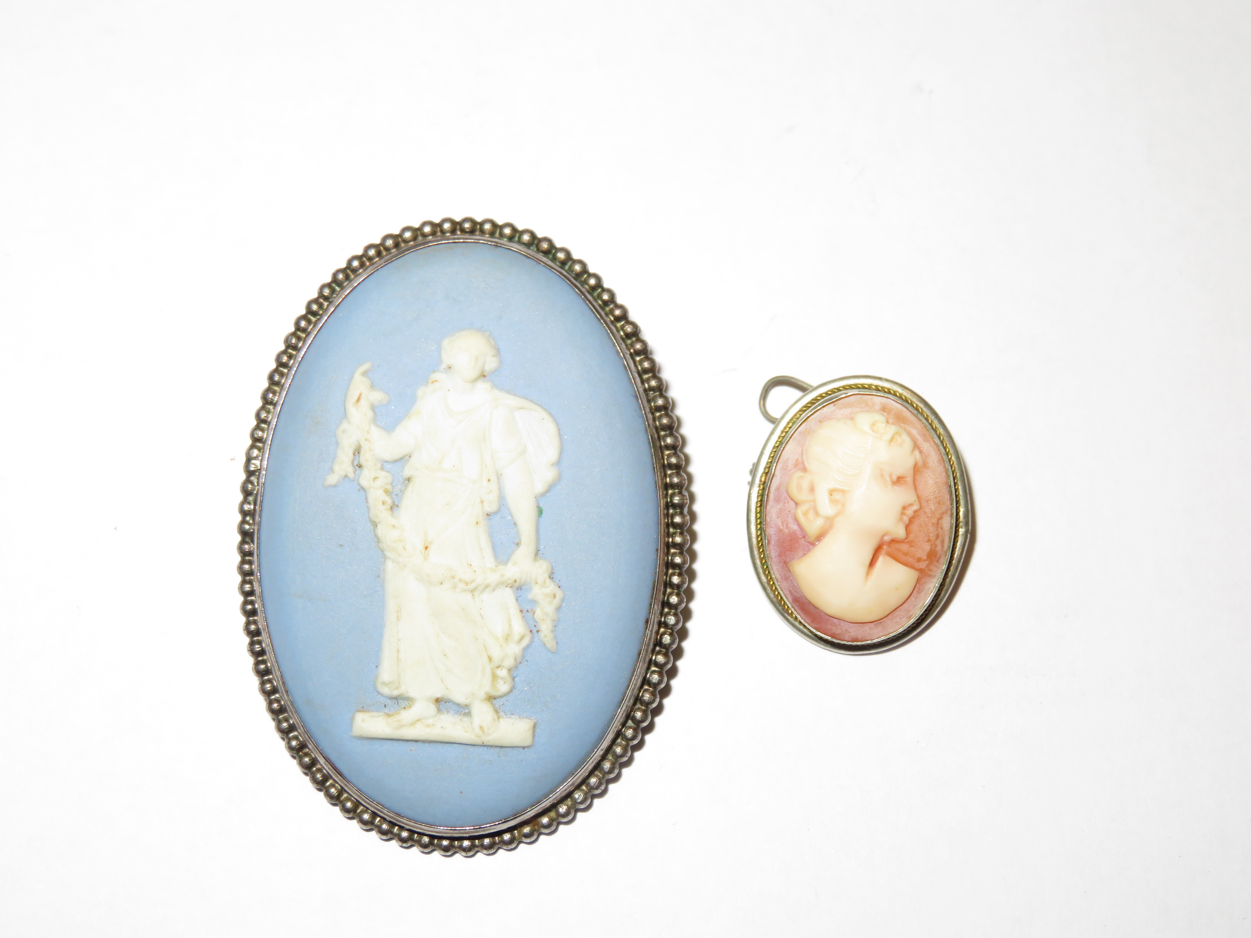 Wedgwood jasper ware pin brooch together with a ca