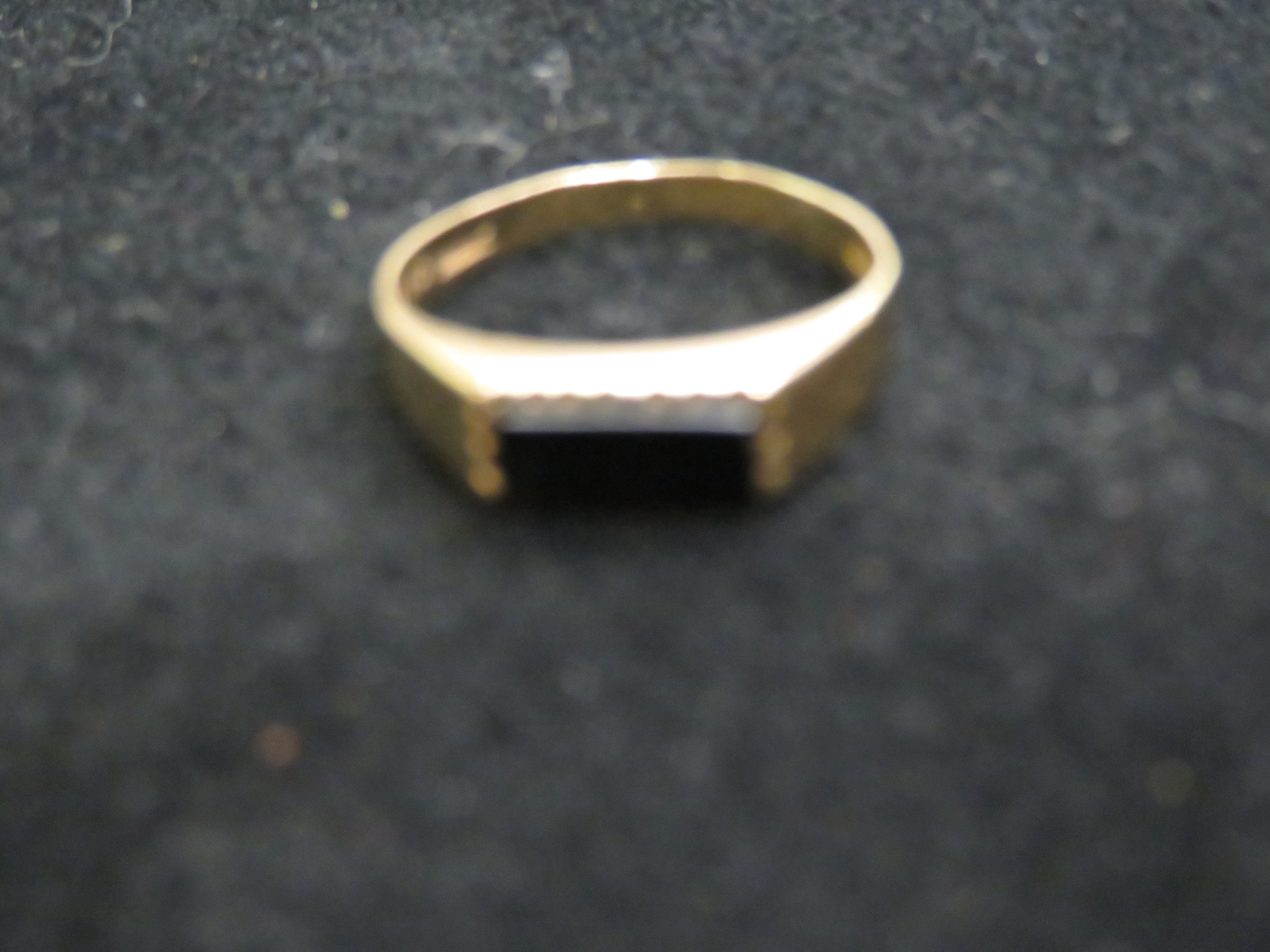 9ct Gold ring set with black stone