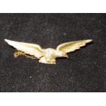 Pin brooch in the from of an eagle, tested for hig