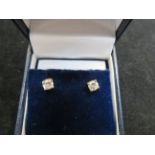 9ct Gold earrings set with solitaire diamonds Appr