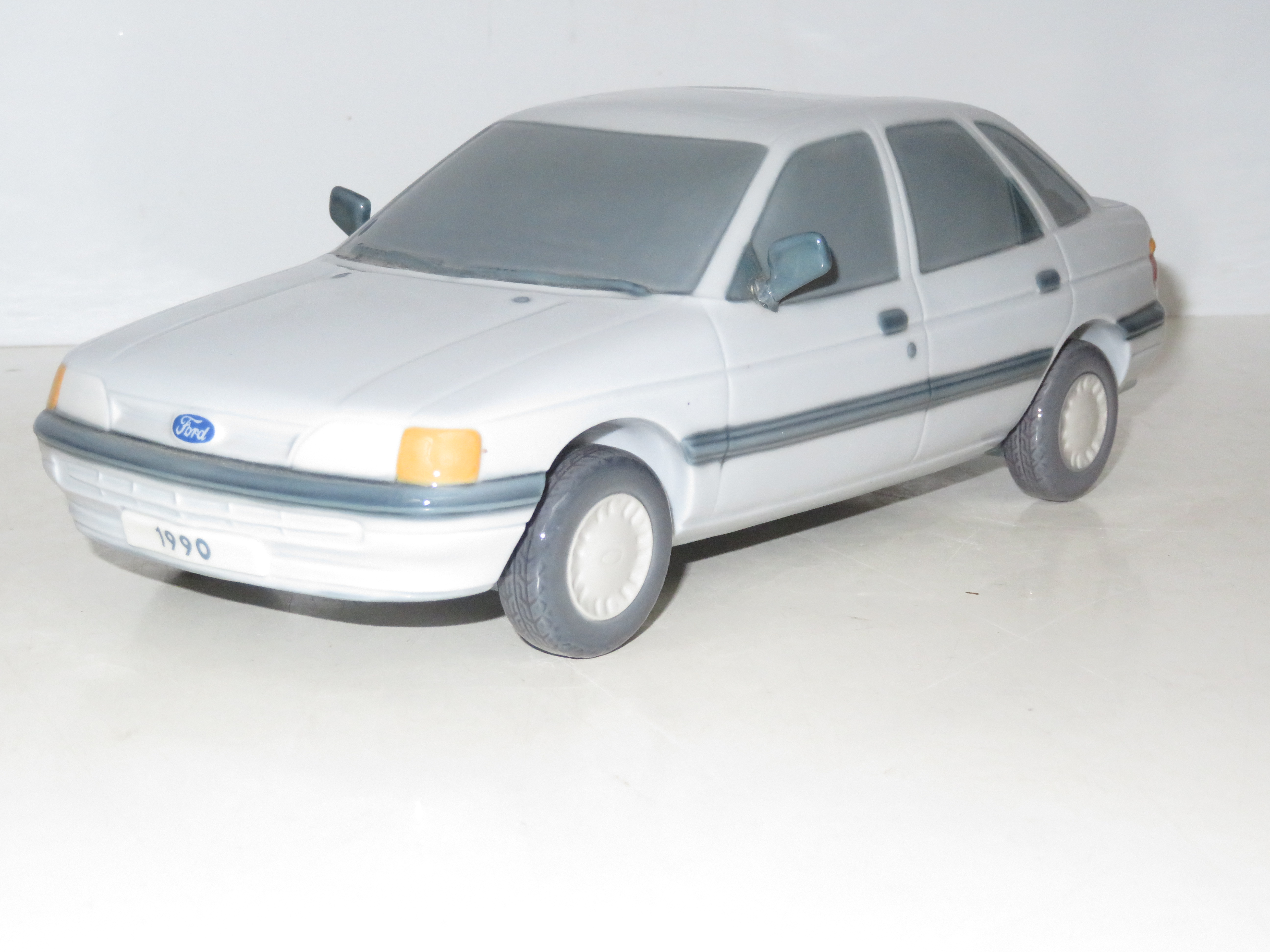 A Lladro model of a Ford Escort, 1990