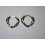 Pair of silver heart shaped earrings
