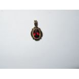 9ct Gold pendant set with red stone