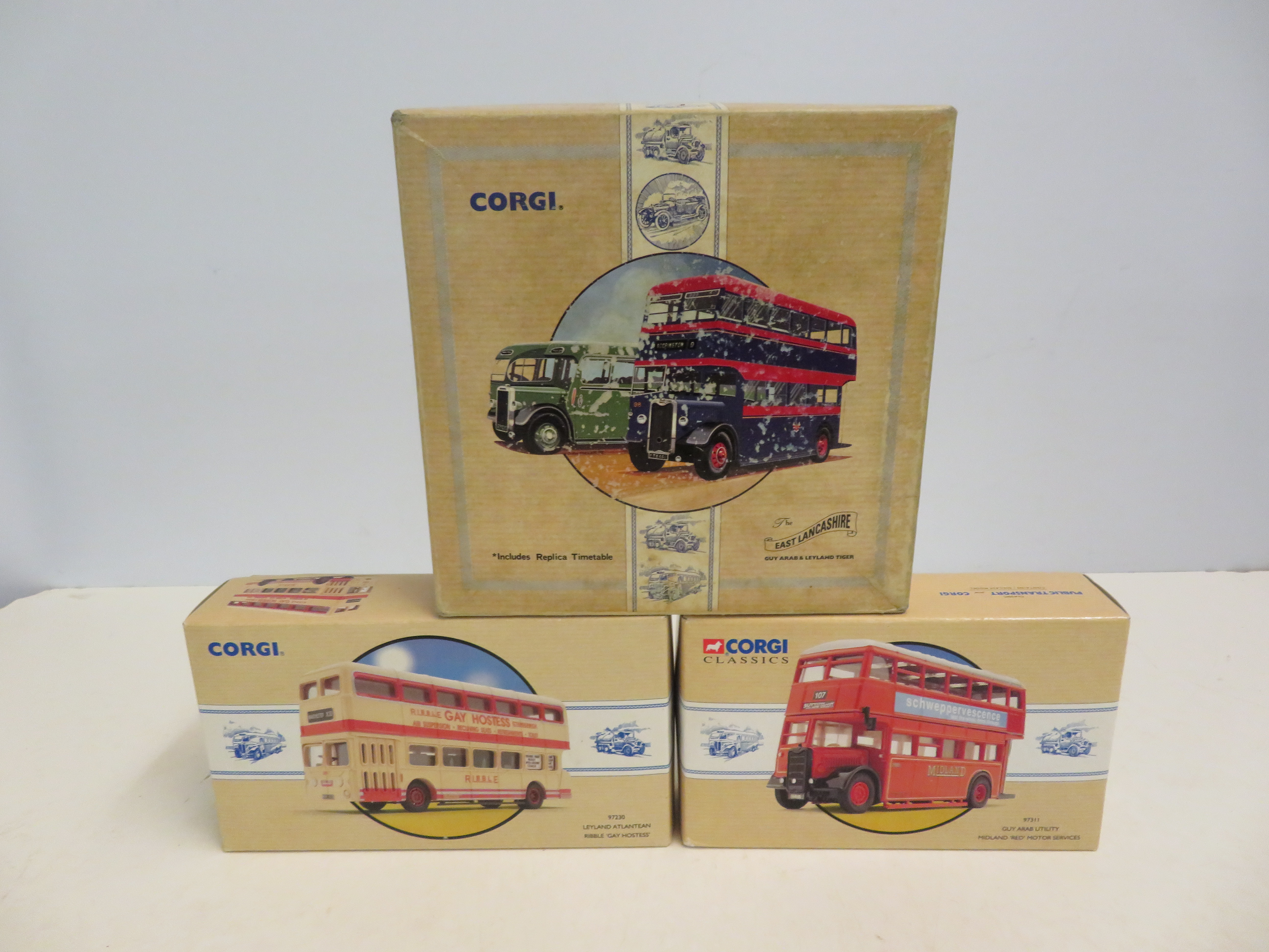 4 Boxed corgi buses, unused with coa's