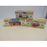 3 Boxed corgi coaches, unused with coa's