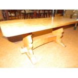 Oak coffee table, in the style of Robert Thompson