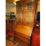 Early 20th century bureau bookcase with leaded lig