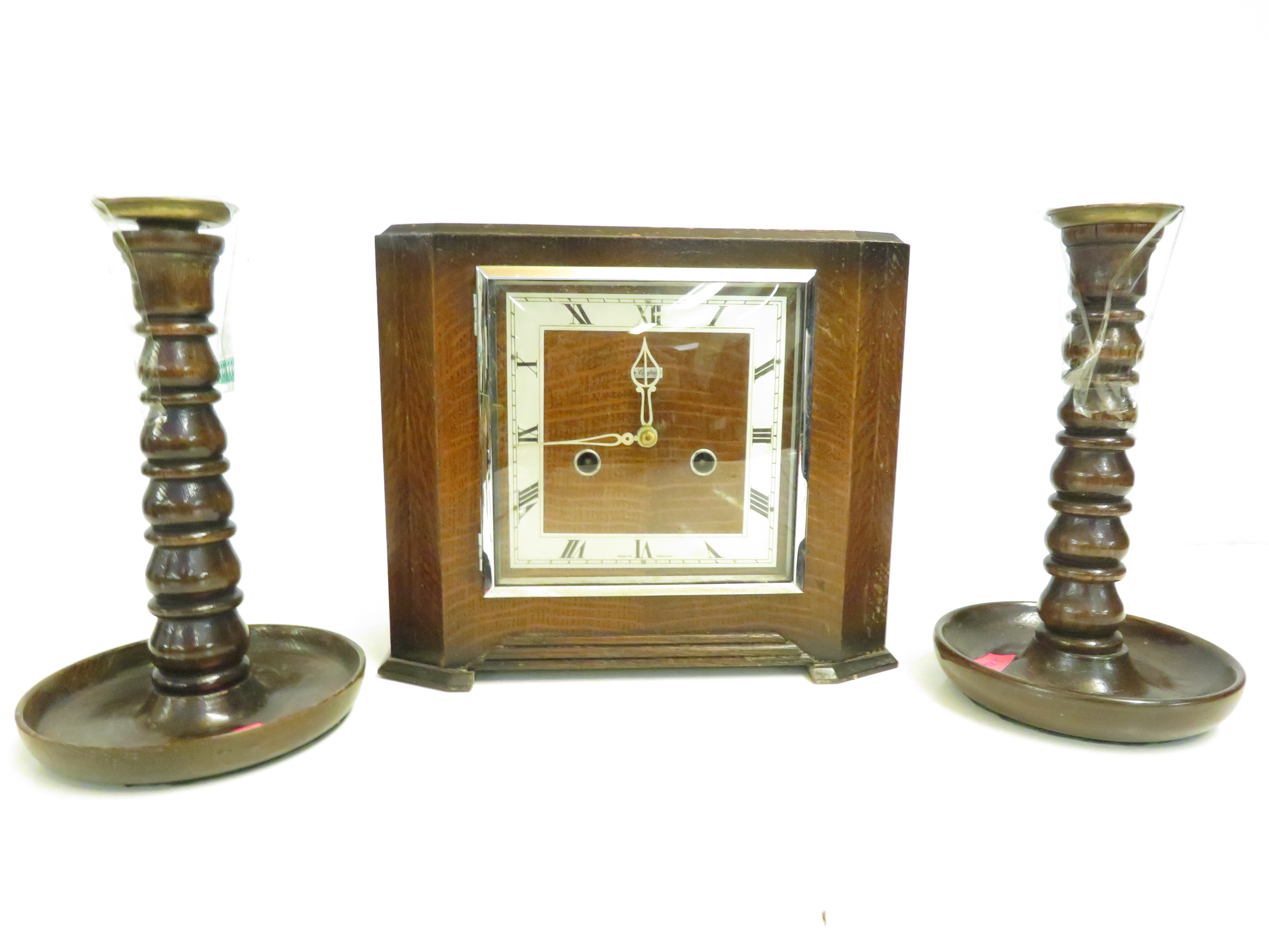 Art deco mantle clock together with a pair of cand