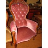 Early buttoned back arm chair