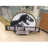 A large "Jurassic Park" film prop sign