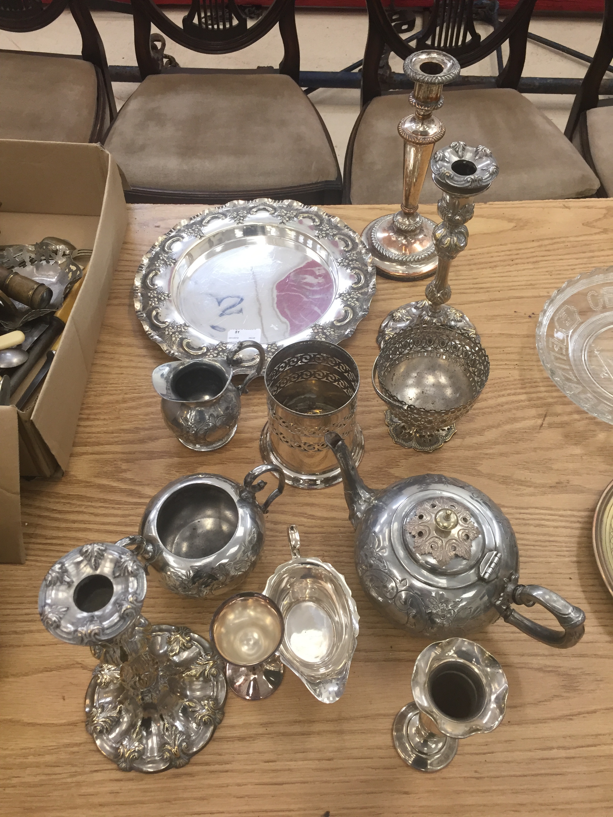 A box of silver plate to inc candlesticks etc