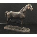 A small bronze figure of a horse